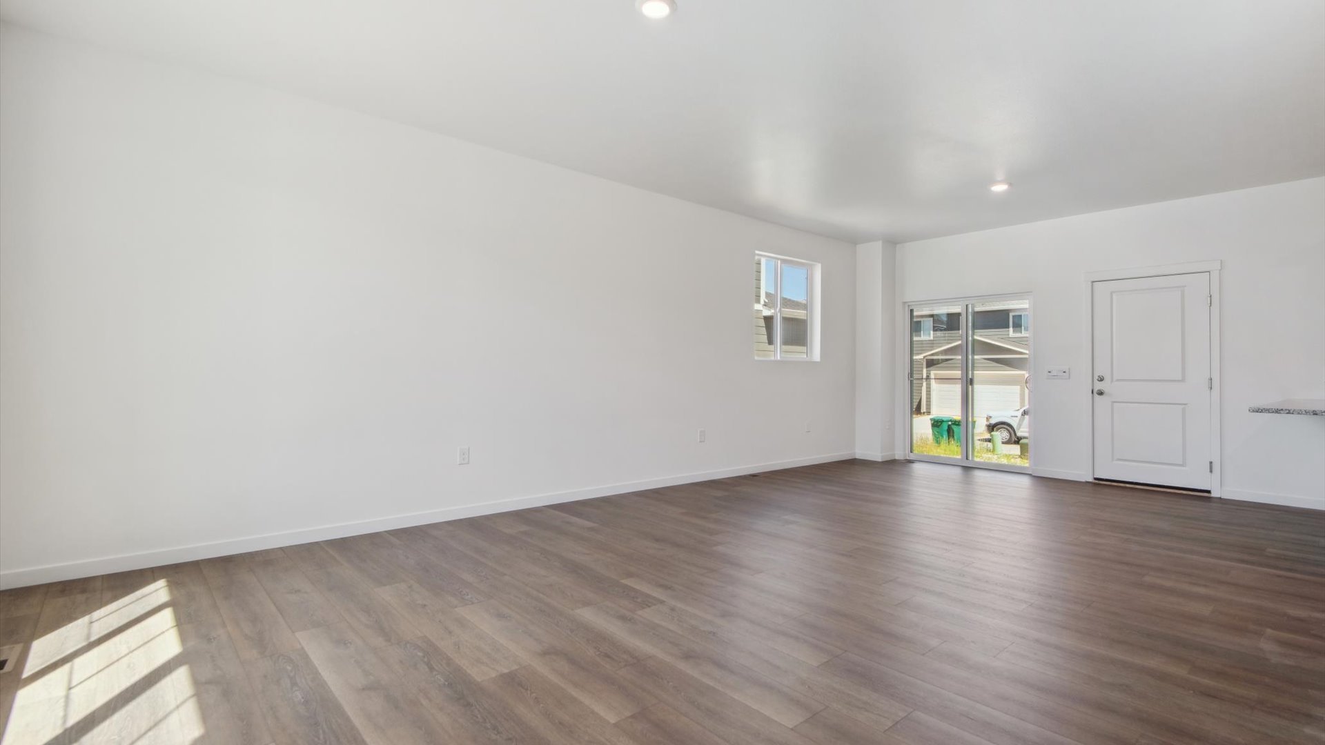 Douglas floor plan dining room off the kitchen features back yard access door, interior garage door and operational window