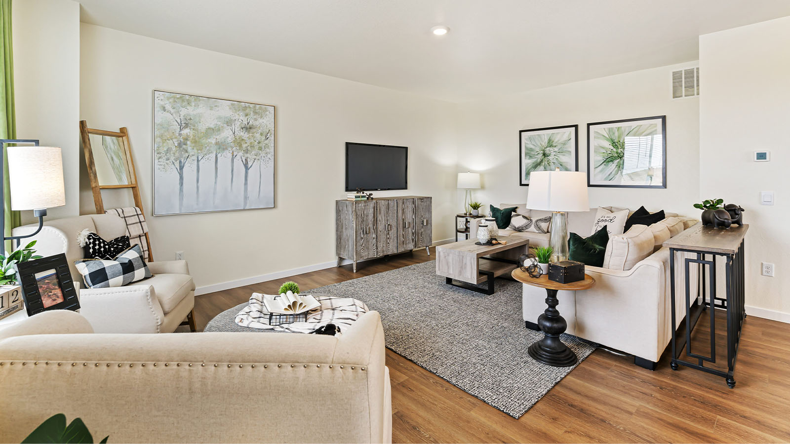 Alamosa model home great room at Horizon Uptown with inviting furnishings, LED lighting and expansive warm tone flooring