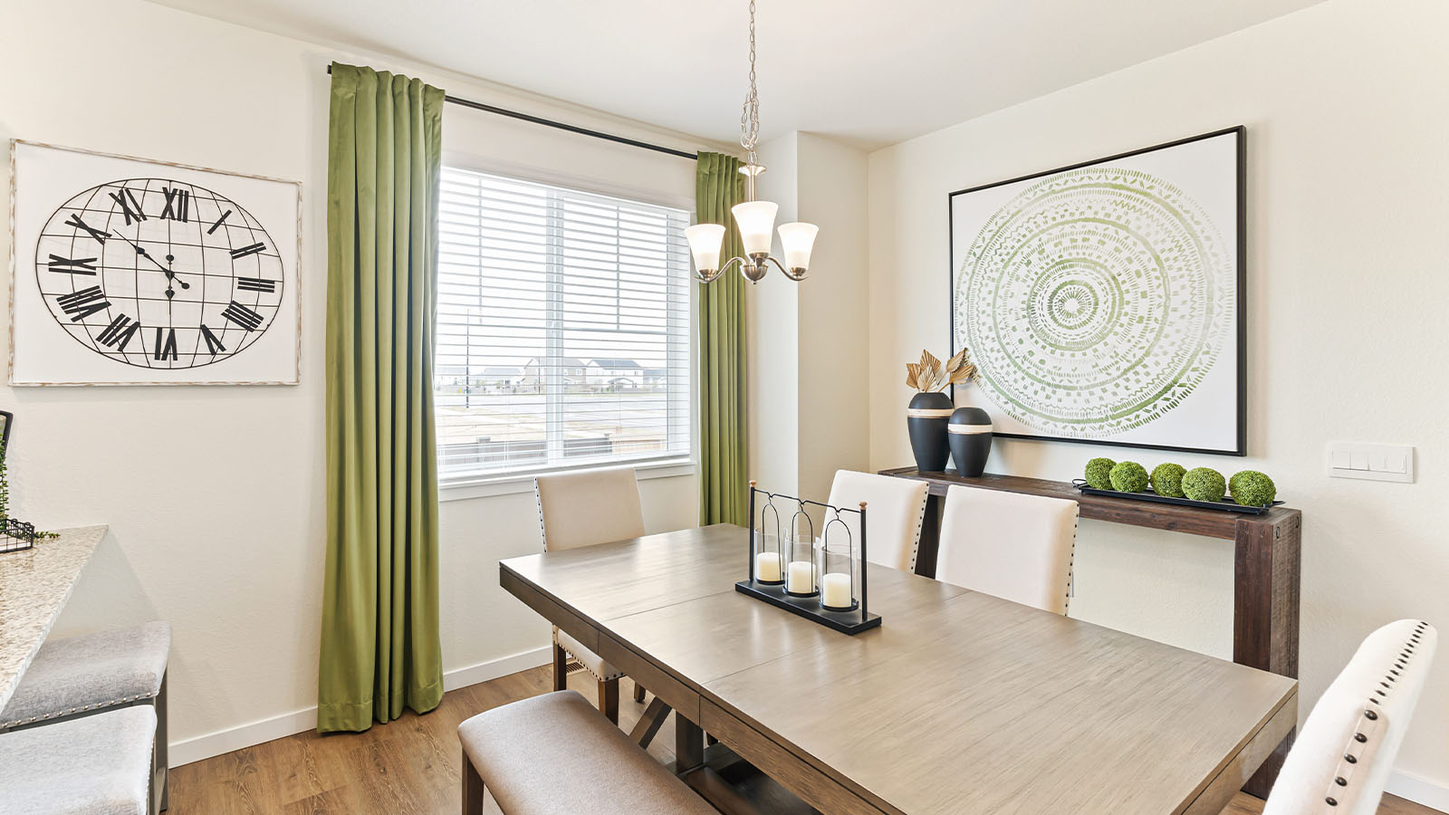 Closeup of dining room in Alamosa design in Horizon Uptown with expansive laminate hardwoods and large gridded windows