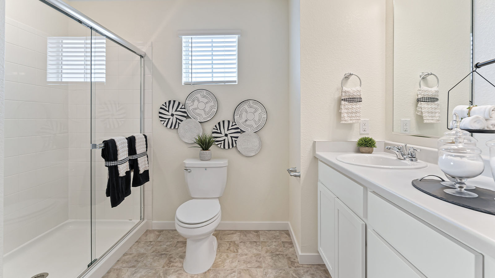 Alamosa private bath alternate view of large glass-enclosed step-in shower and clerestory window above toilet