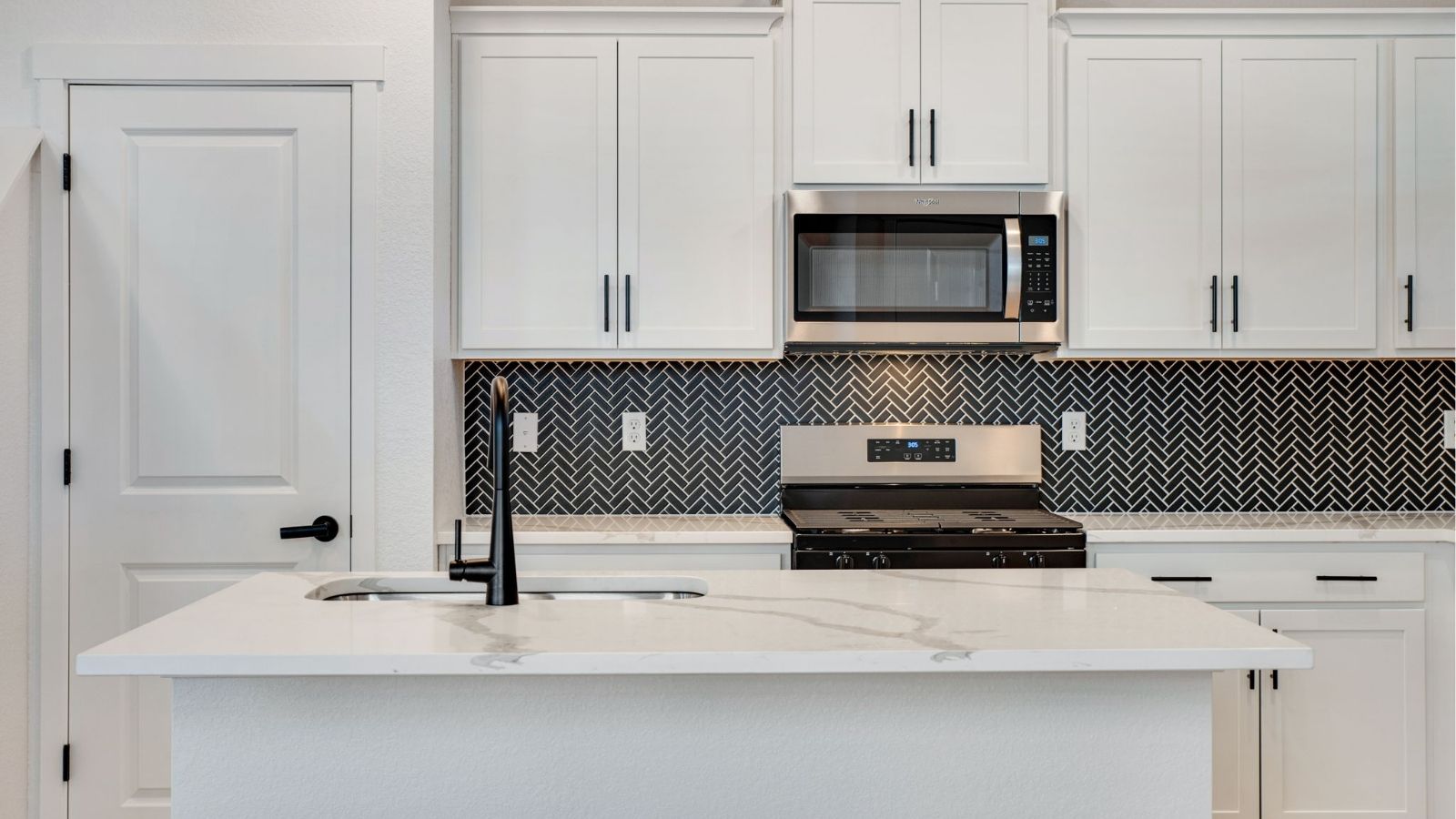 kitchen with white cabinets in new home