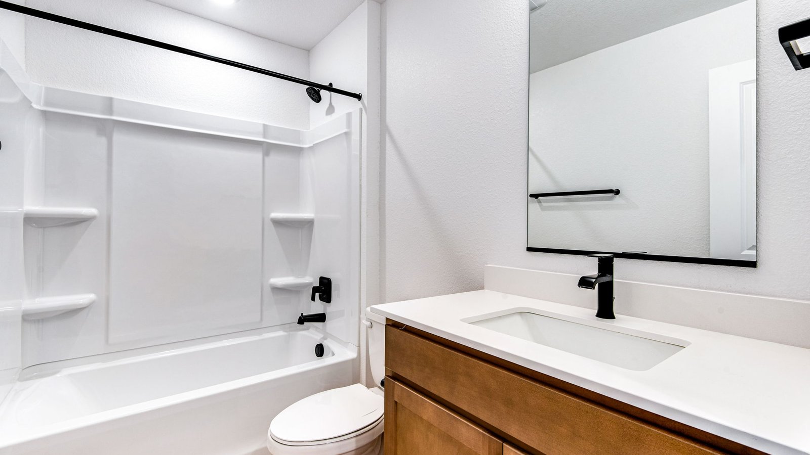 Designer bathroom showcasing updated fixtures and a fresh, polished look.