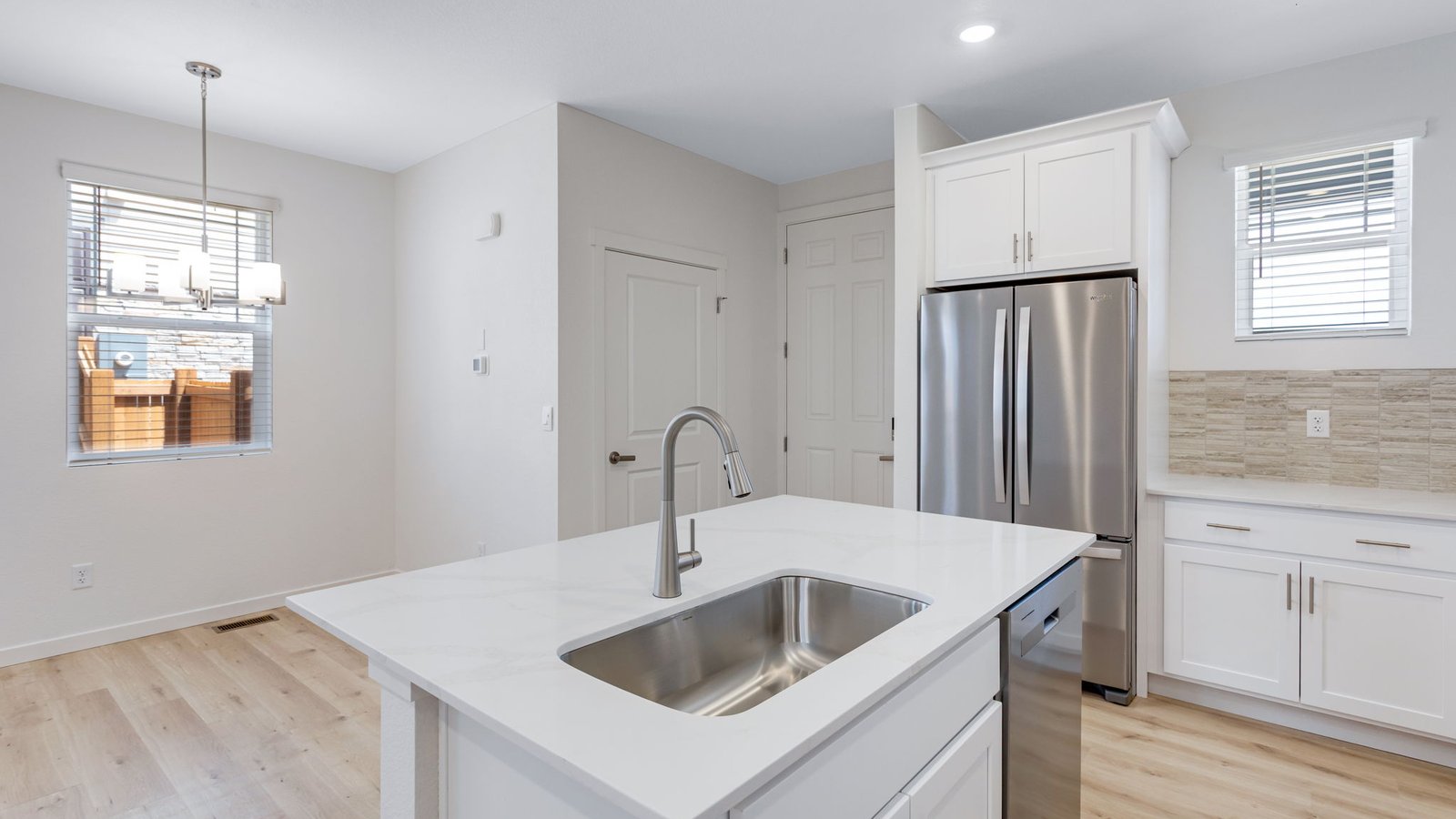 Kitchen with new finishes in Aurora Colorado in new home community Horizon Uptown