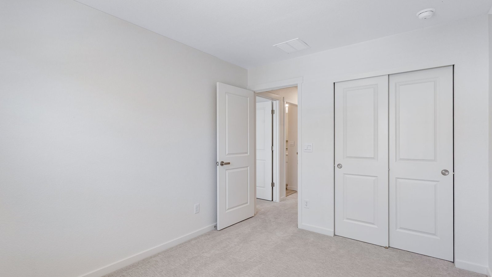 Secondary bedroom with spacious closets in new D.R. Horton home in Aurora Colorado