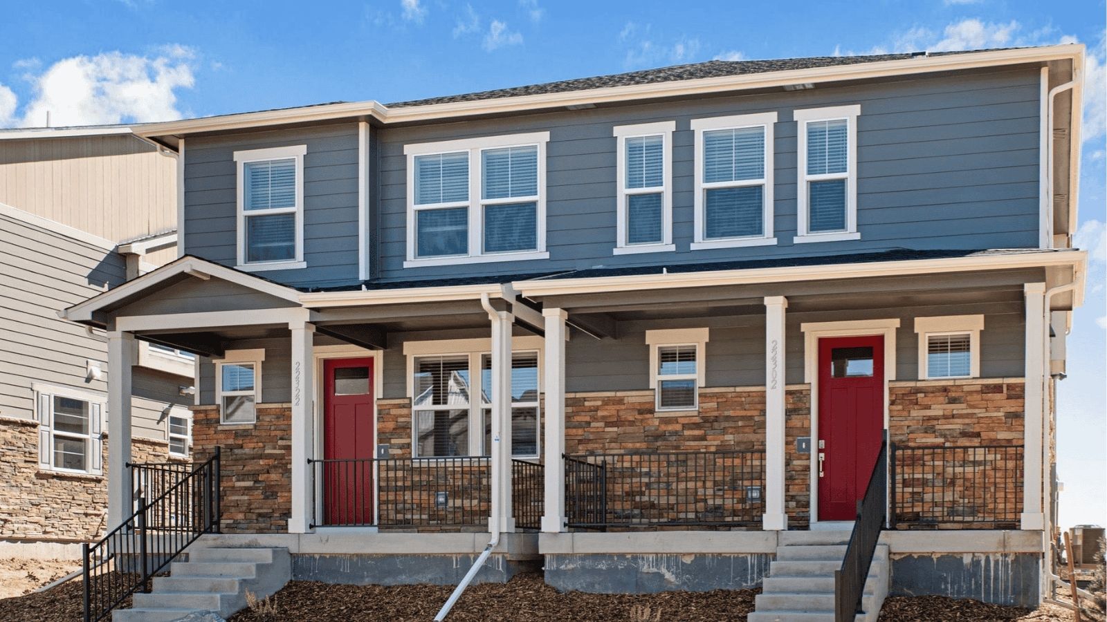 Exterior of two story paired home in new home community Horizon Uptown