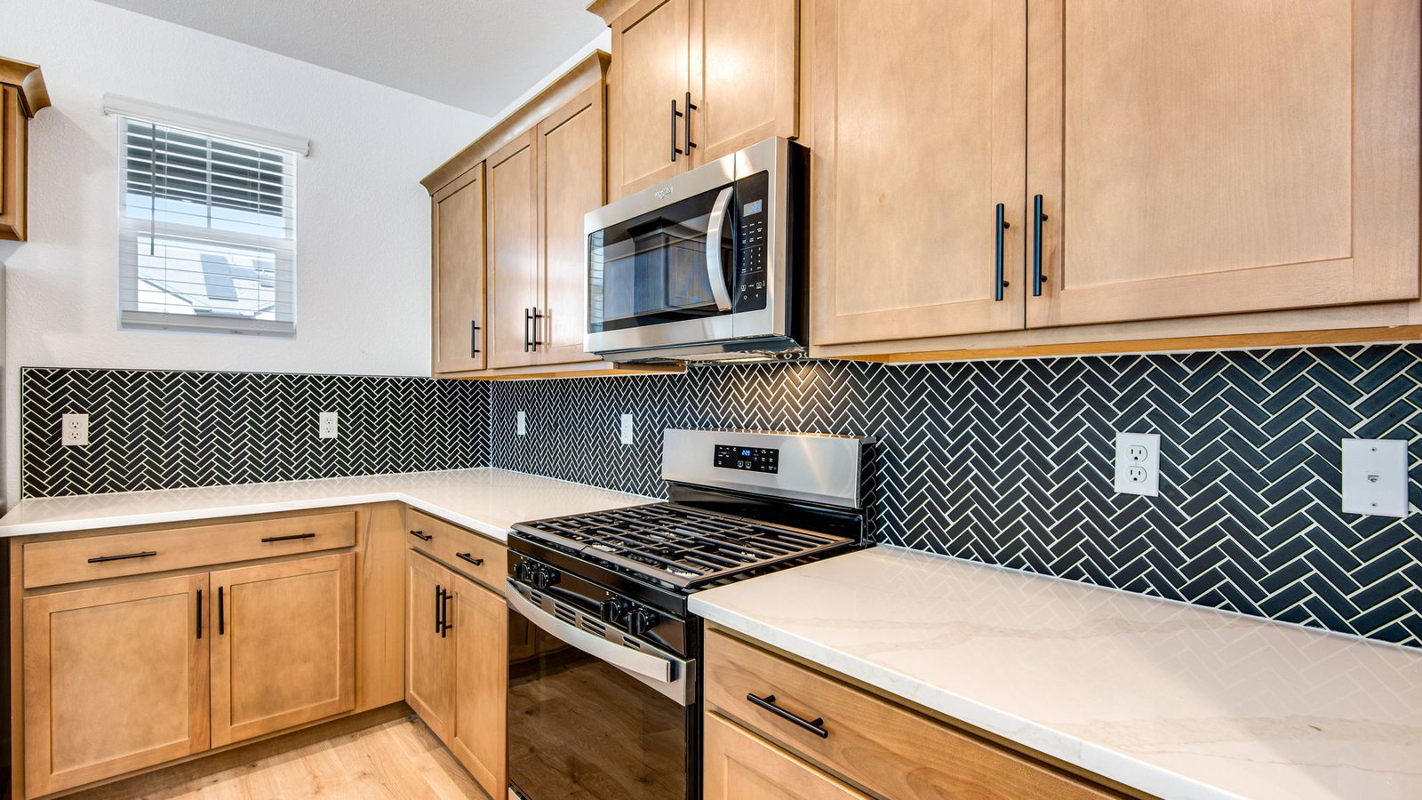 modern kitchen with brown cabinets and white countertops