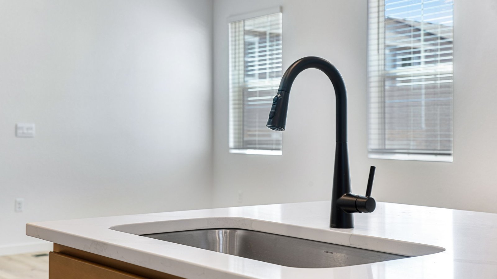 kitchen island with sink and black faucet