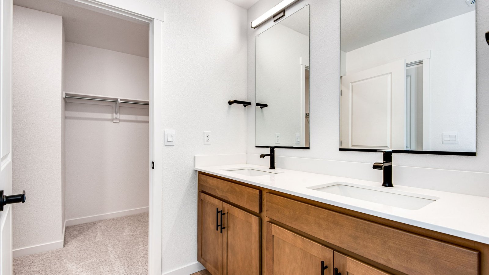 primary bathroom with dual sinks
