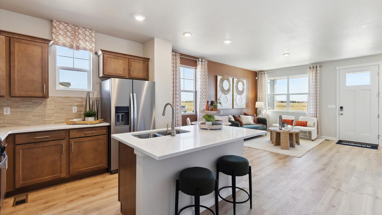 Open-concept Augusta kitchen featuring stainless-style finishes, ample cabinet storage, and functional layout