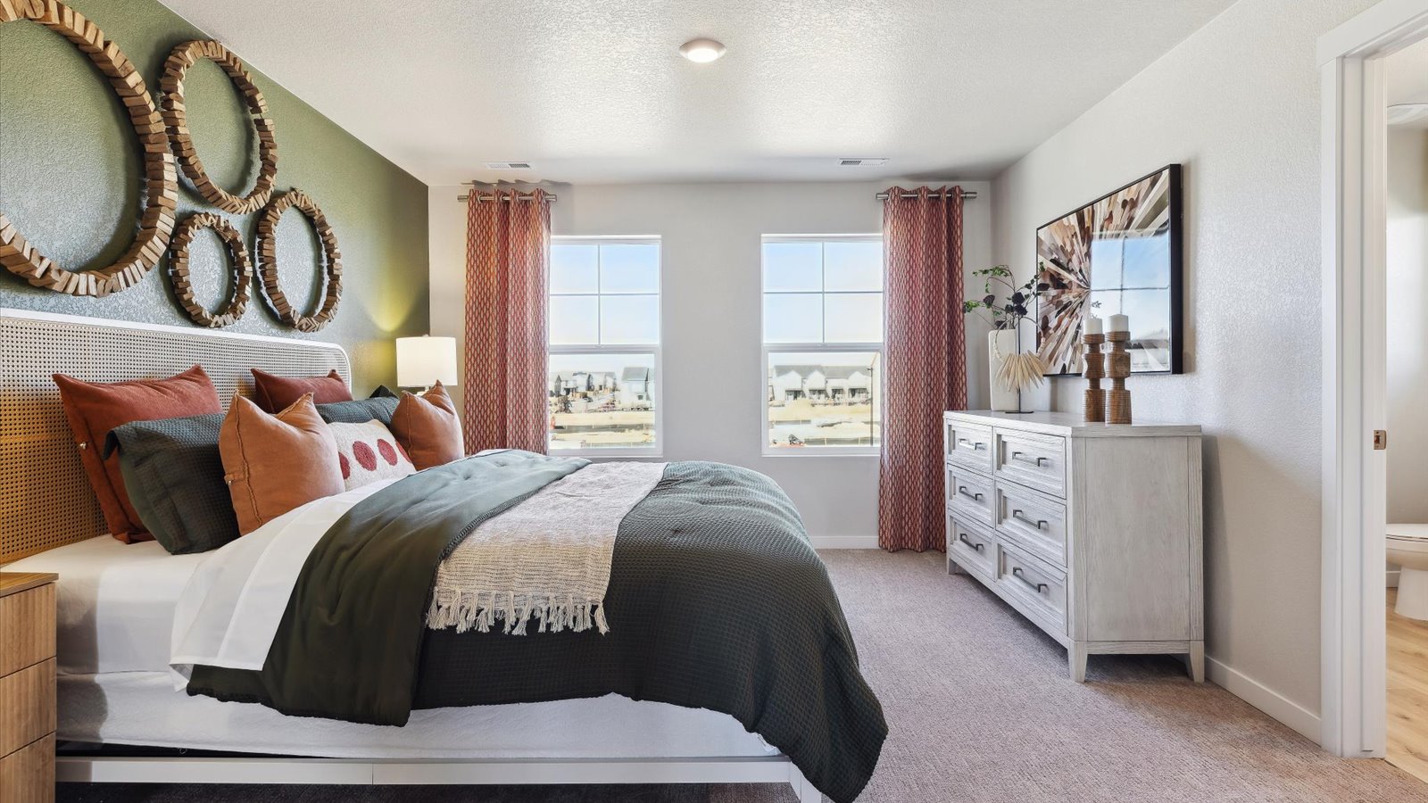 Primary bedroom in Augusta floorplan with spacious layout, natural light, and comfortable design