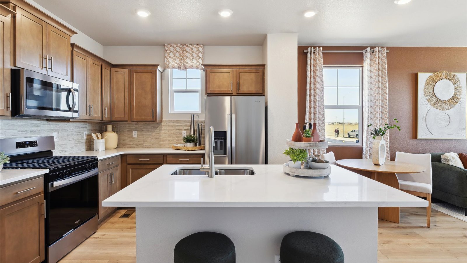 Two‑story Augusta townhome layout at Horizon Uptown highlighting open living spaces on the main floor and private bedrooms upstairs.