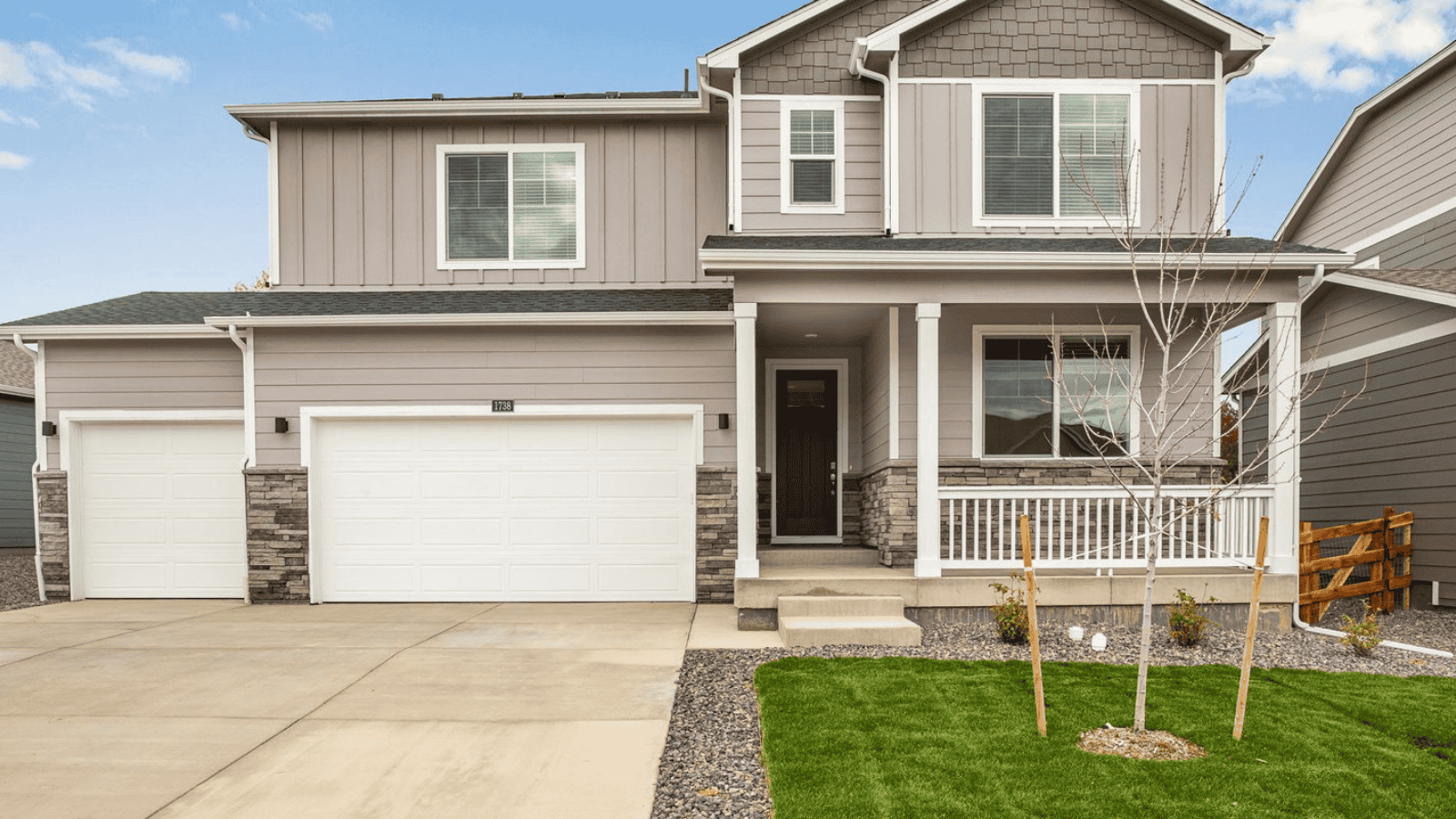 Exterior of 2 story home with 3 car garage in new D.R. Horton Hansen Farm community Fort Collins, CO