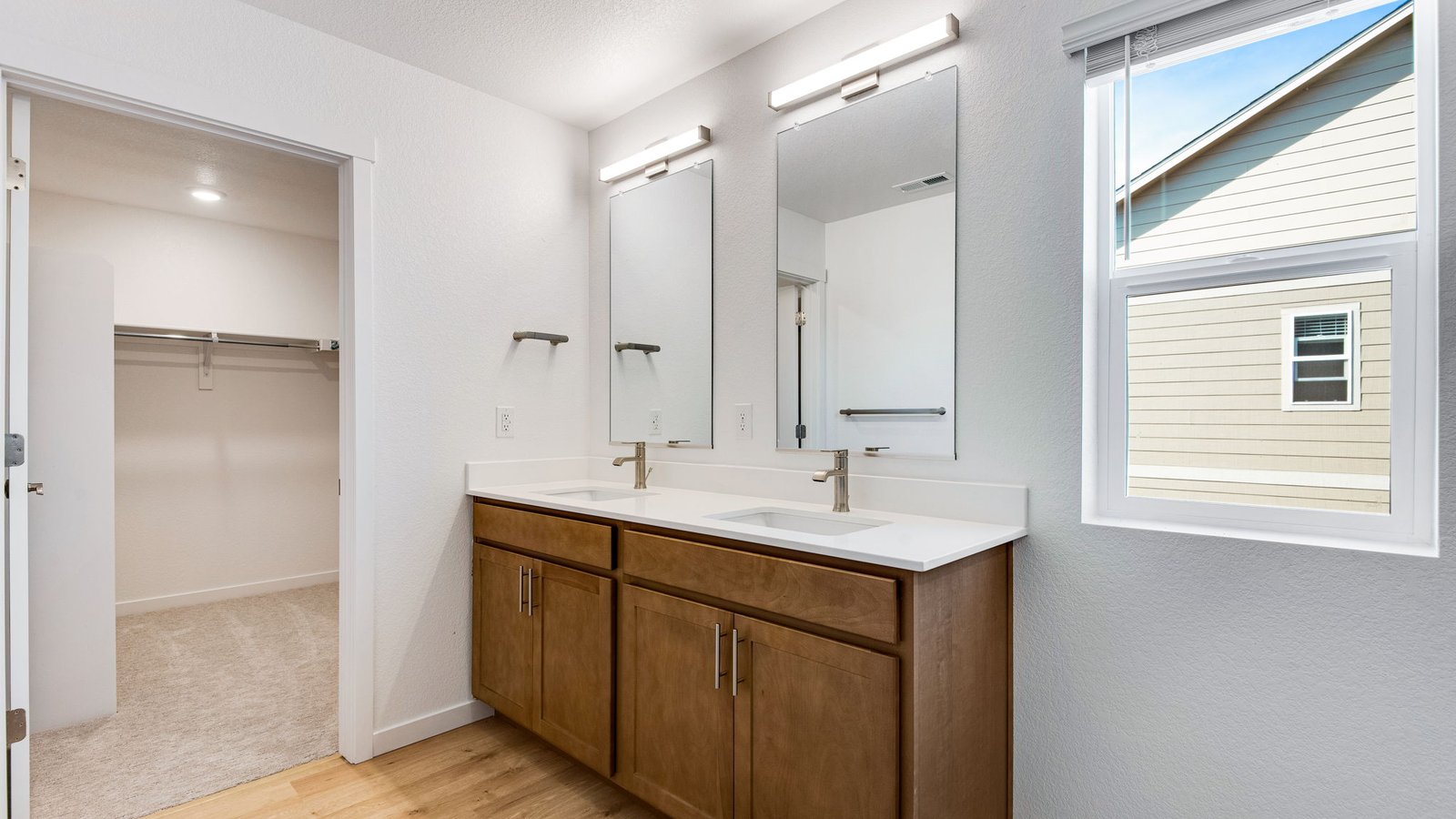primary bathroom with walk in closet
