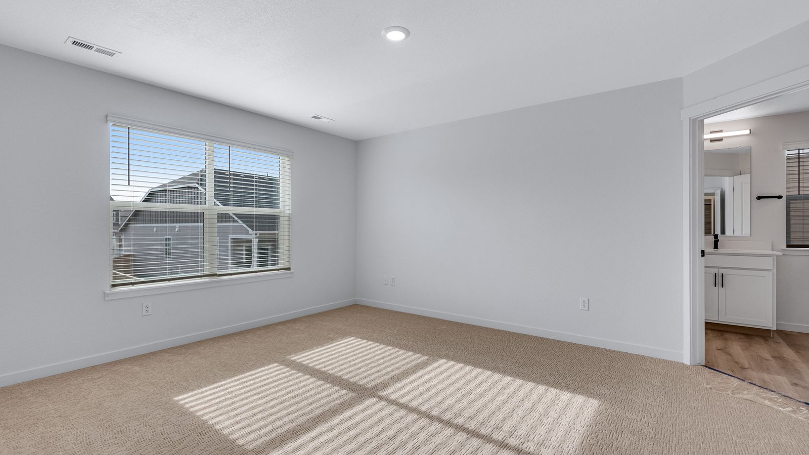 large primary bedroom new home