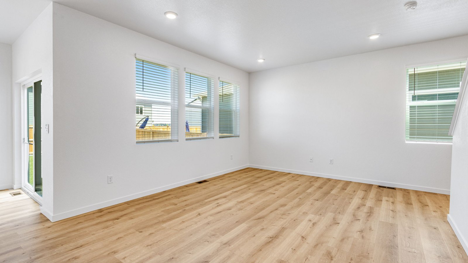 Spacious living room in the Edmon home designed for gathering with family and friends in a comfortable setting.