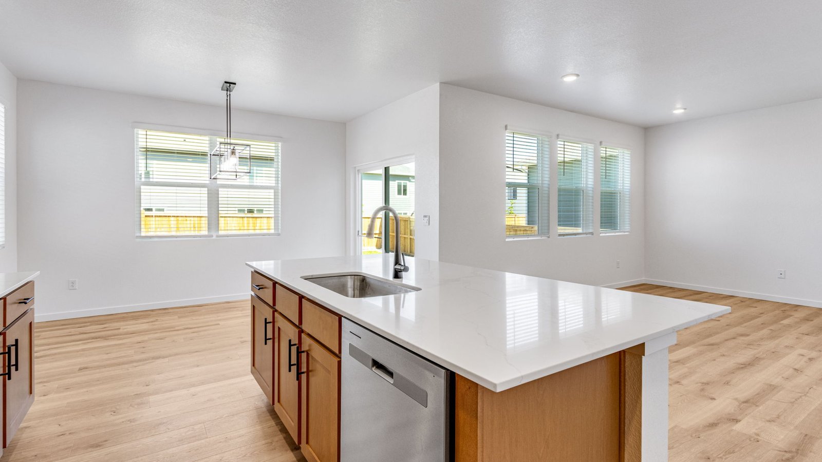 Bright eat-in kitchen in the Edmon floor plan with contemporary finishes and plenty of space for meal preparation and gathering.