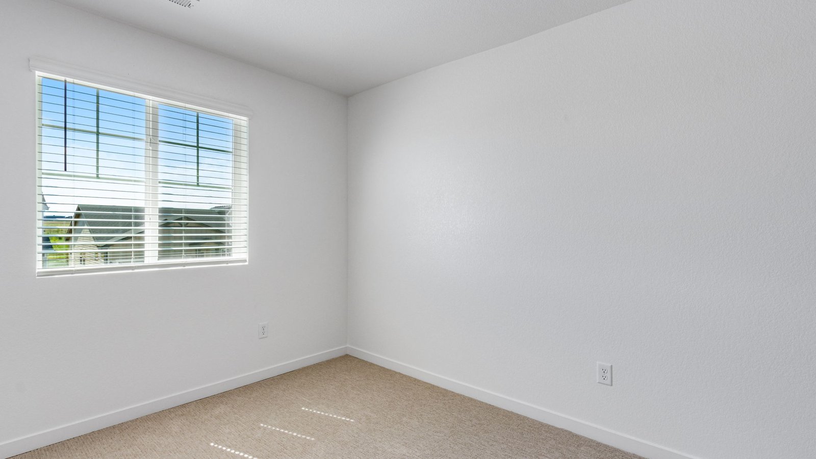 Additional bedroom in the Edmon floor plan designed for family, guests, or a home office.