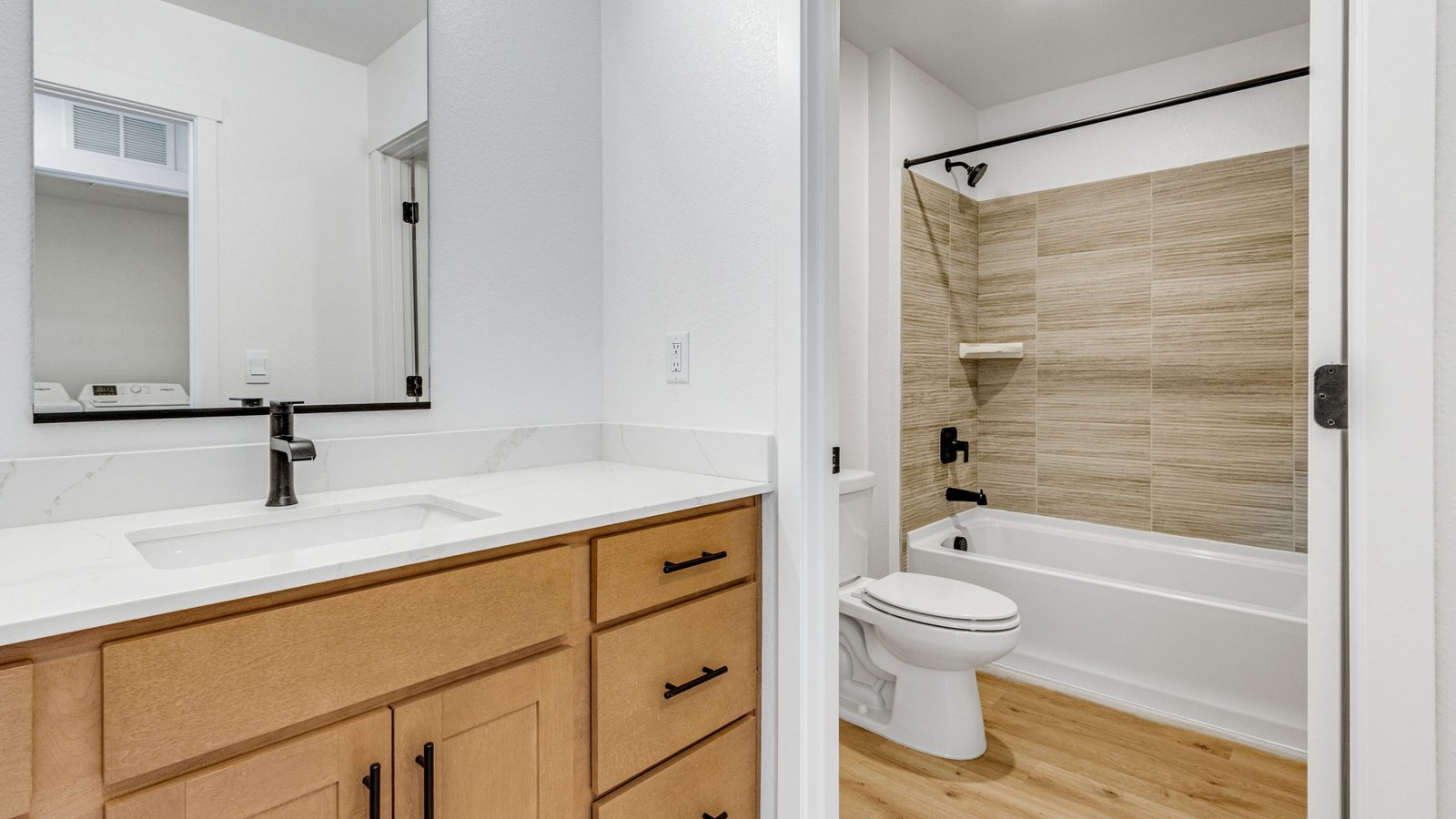 Full secondary bathroom in the Edmon floor plan featuring modern fixtures and a practical layout.