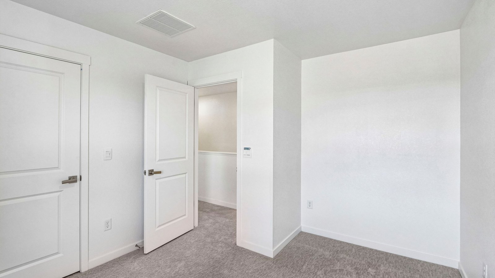 Well-sized bedroom ideal for family members, guests, or a home office.