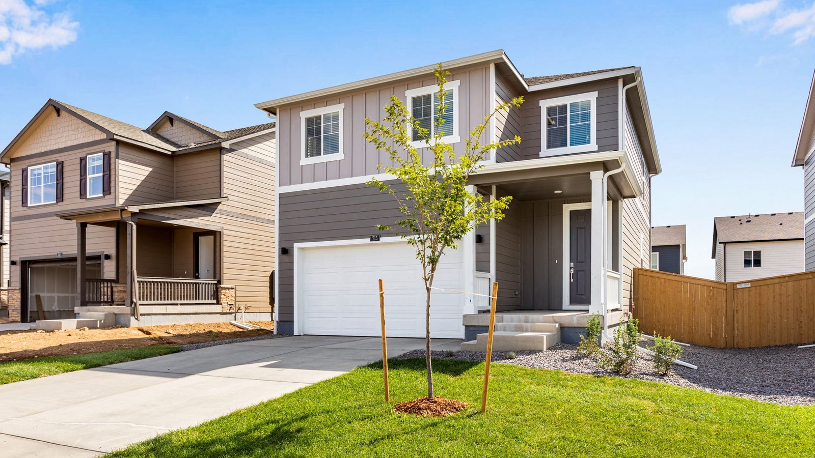 Charming two-story home in Windsor, Colorado showcasing contemporary design and welcoming front entry.