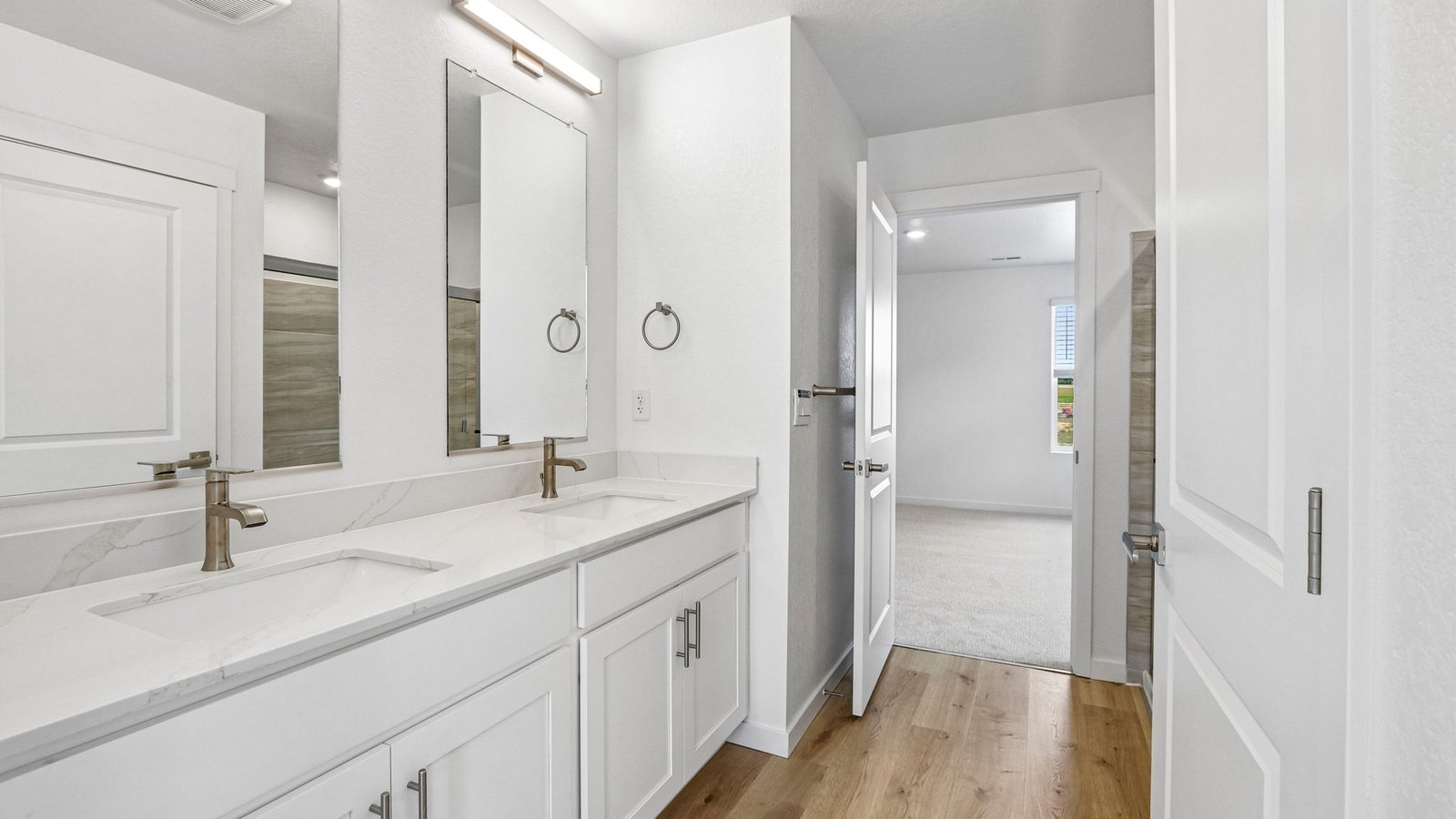 Spacious owner's bath with ample countertop space and contemporary design.