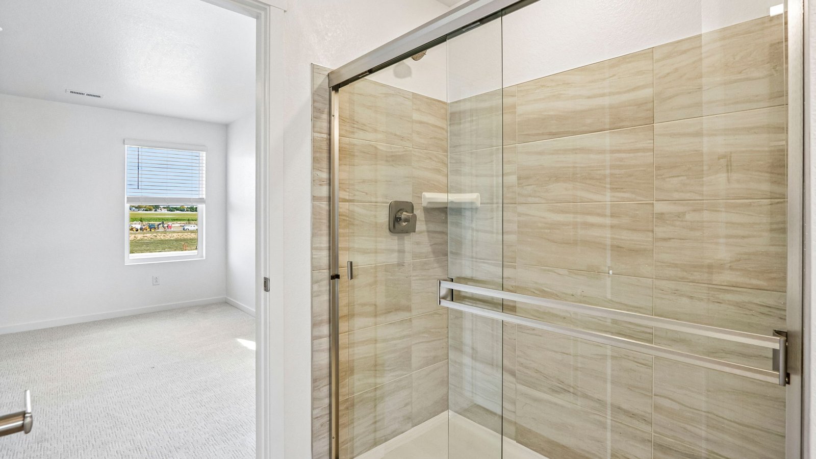 Elegant primary bathroom offering both style and functionality.