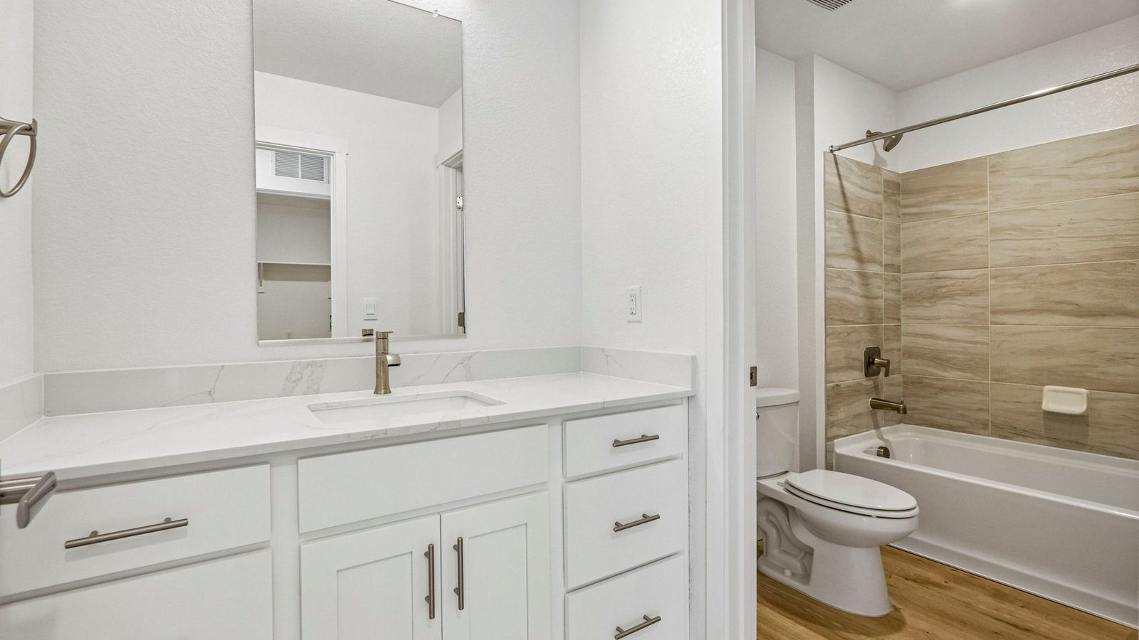 Bright shared bathroom featuring functional design and contemporary style.