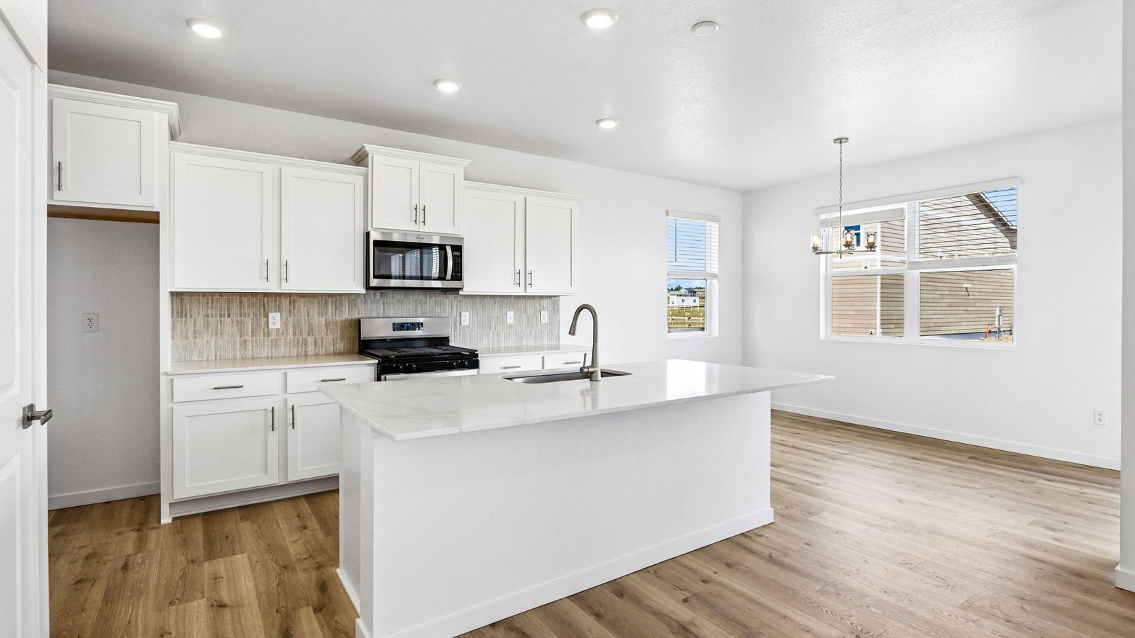 Spacious eat-in kitchen featuring abundant counter space, modern finishes, and ample storage.