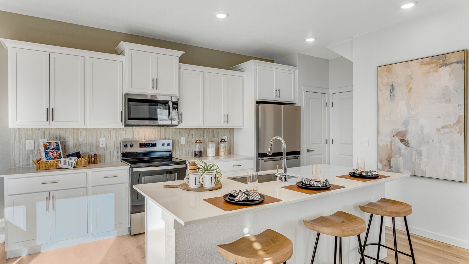 Modern kitchen with white cabinets in new D.R. Horton home