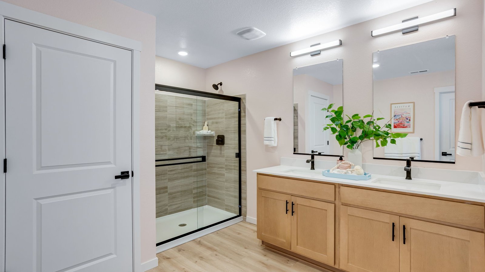 primary bathroom with dual sinks and shower in new construction home windsor, co