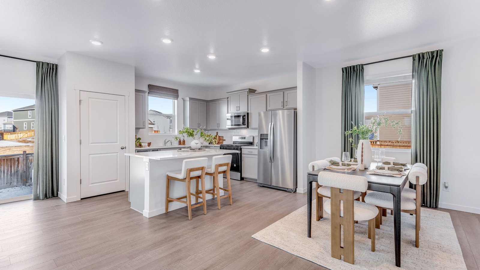Dedicated dining area conveniently located between the kitchen and living room.
