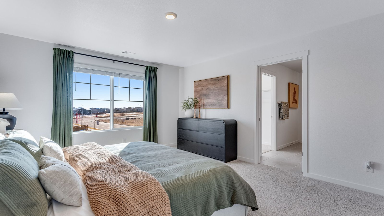 Elegant primary bedroom designed for comfort and everyday relaxation.