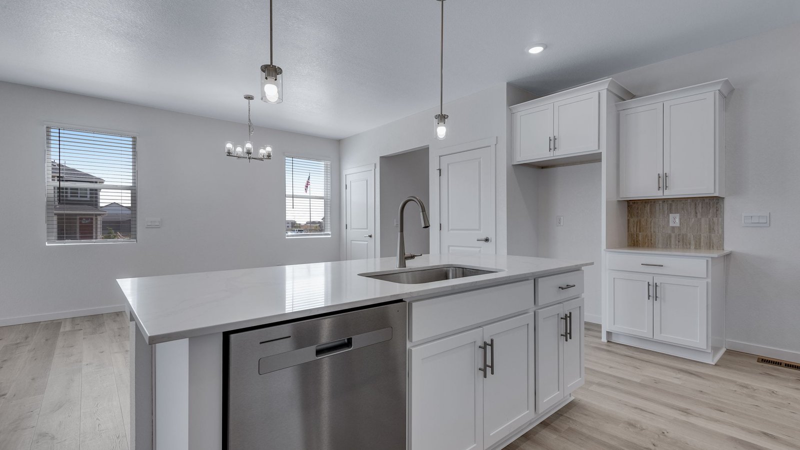 Large center island serving as the focal point of the open-concept kitchen.
