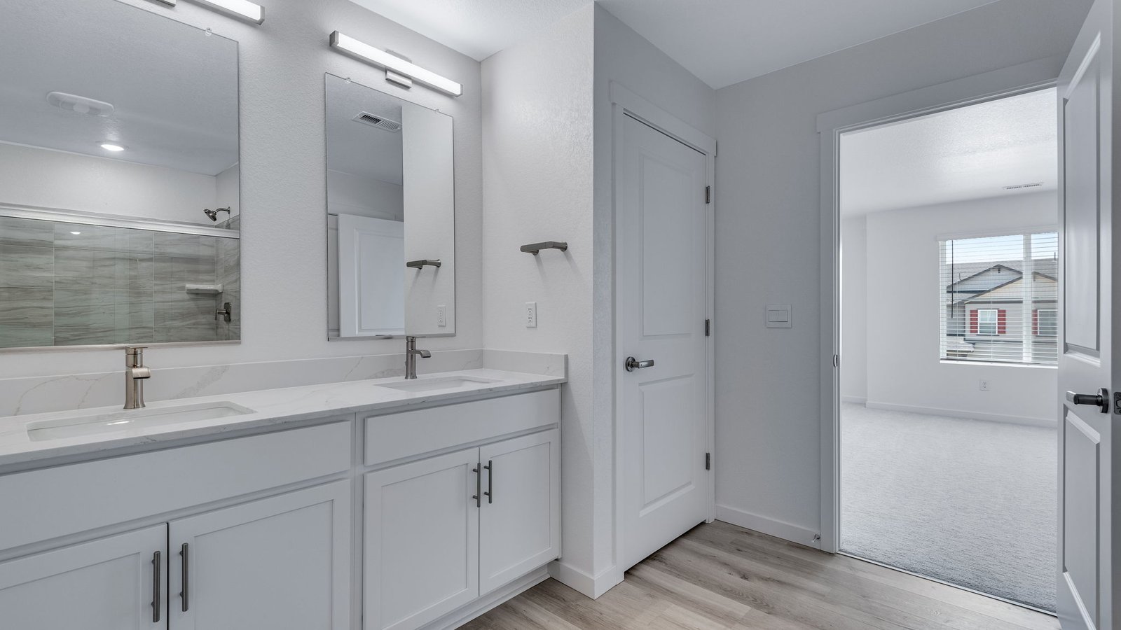 Primary bathroom featuring modern fixtures, dual-purpose functionality, and ample space.