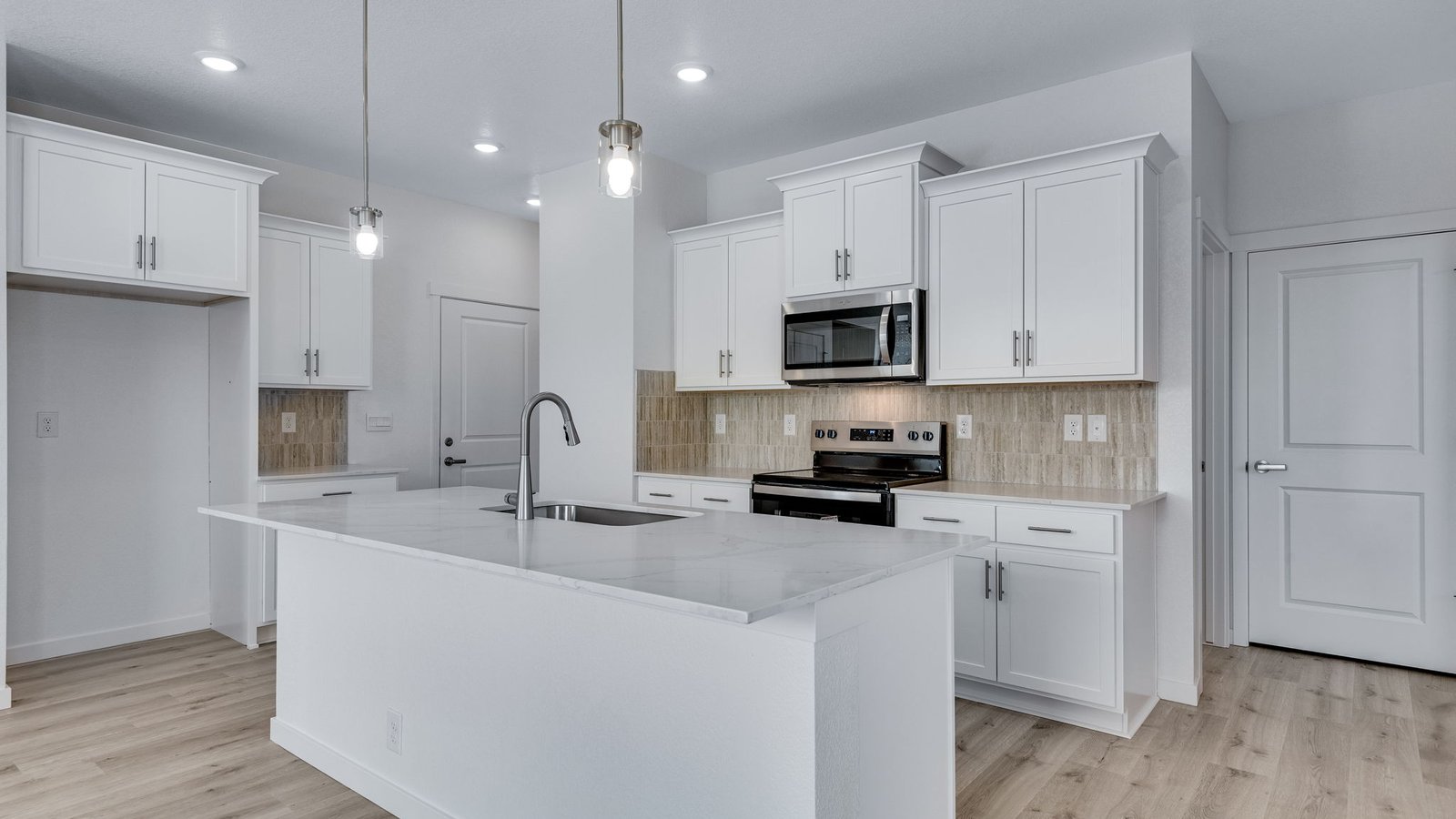Spacious kitchen designed for meal preparation, dining, and entertaining guests.