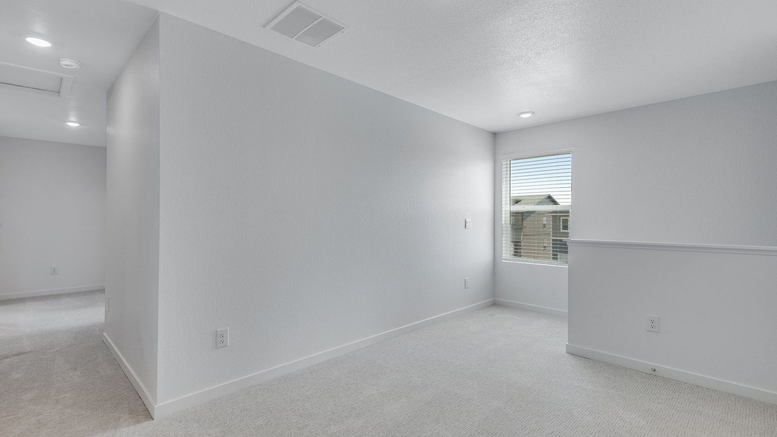 Open loft providing additional living space for changing household needs.
