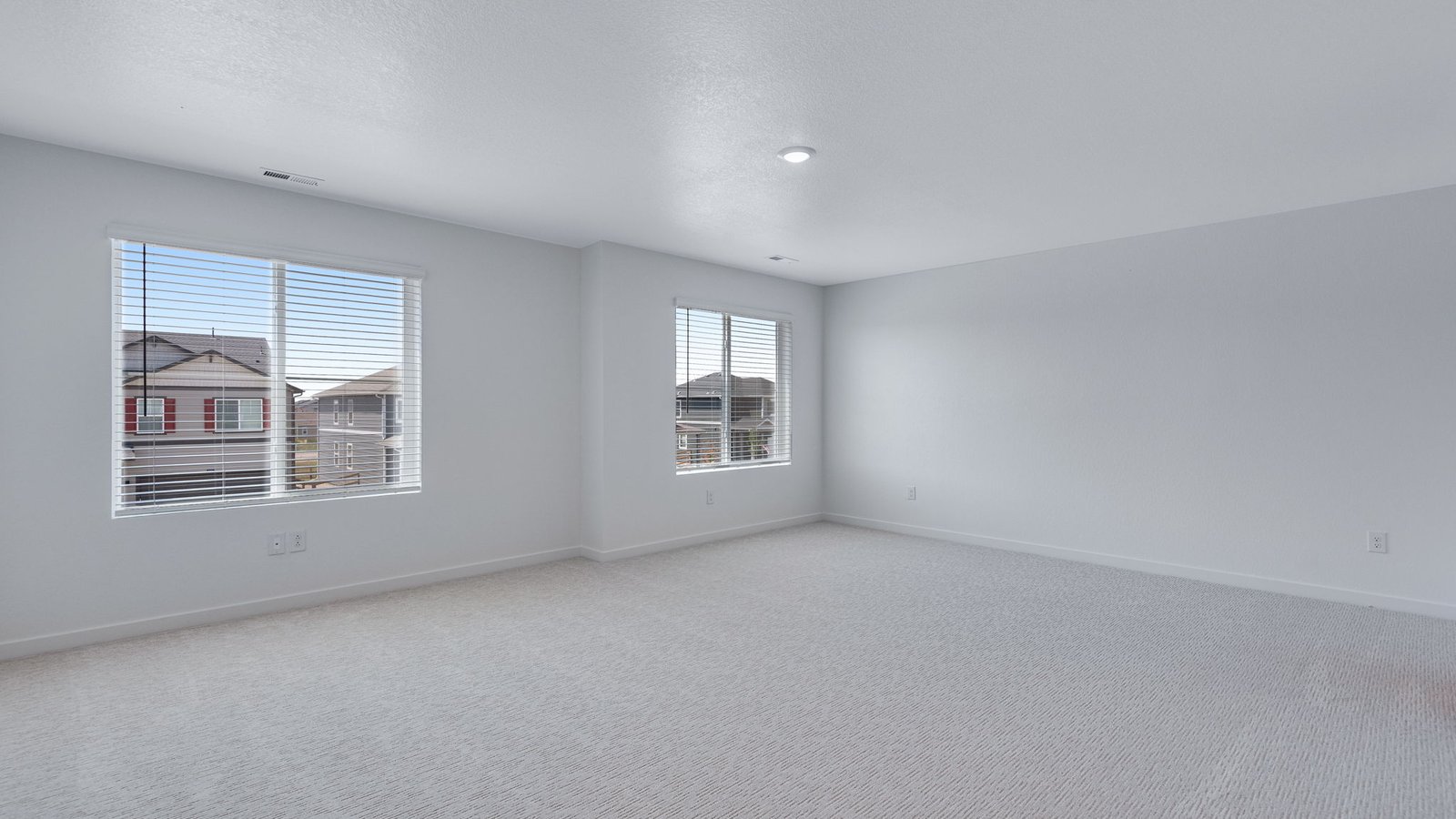 Private primary suite in the Elm floor plan featuring a spacious layout and abundant natural light.
