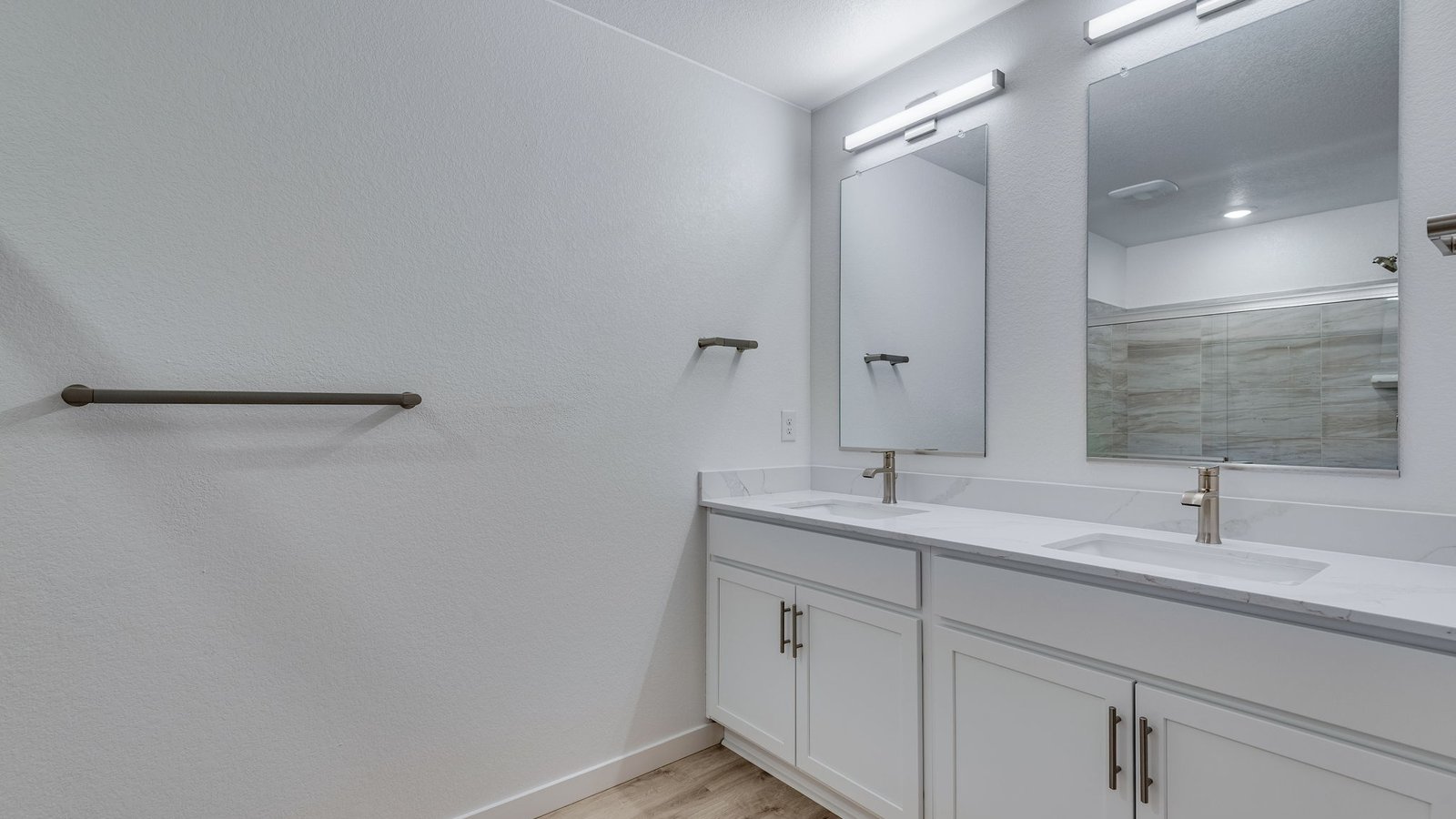 Primary bathroom featuring modern fixtures, dual-purpose functionality, and ample space.
