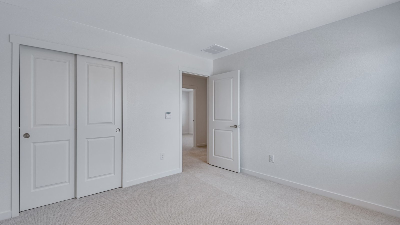 Comfortable bedroom designed for family members or overnight guests.