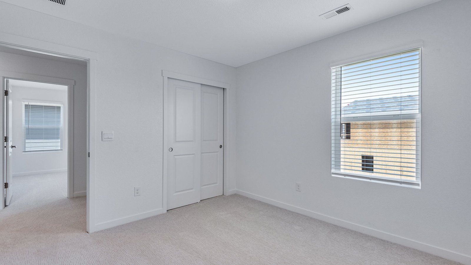 Versatile bedroom offering privacy and functional living space.