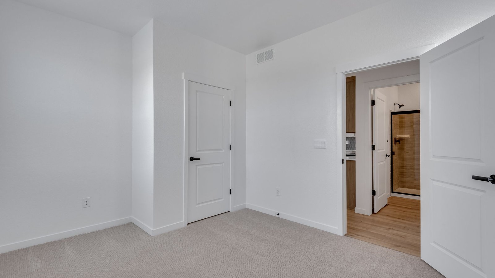Convenient first-floor bedroom with nearby full bathroom in the Elm floor plan.