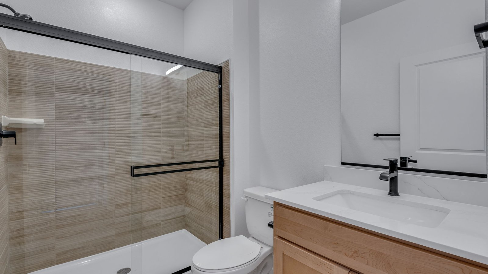 Main-floor bathroom featuring modern fixtures and functional design.