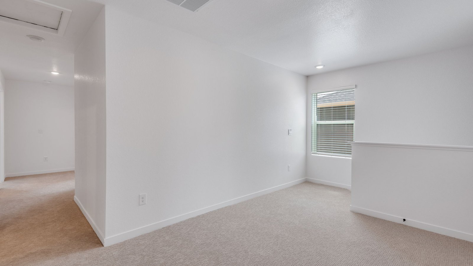 Bright second-floor loft with flexible space for various lifestyle needs.