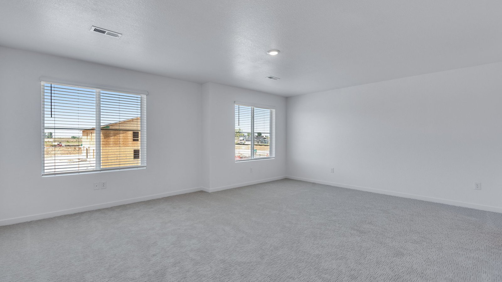 Private primary suite in the Elm floor plan featuring a spacious and relaxing layout.