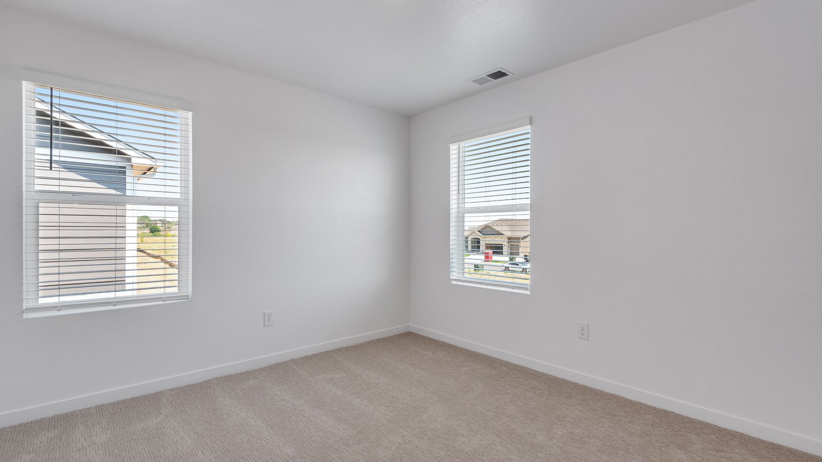 Bright bedroom designed for family members or overnight guests.