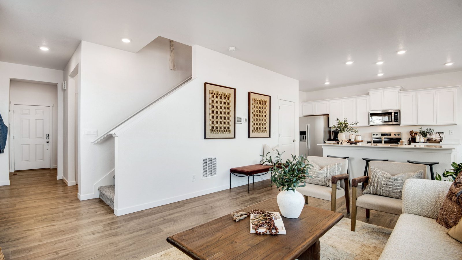 Open-concept living room in The Edmon designed for comfortable everyday living.