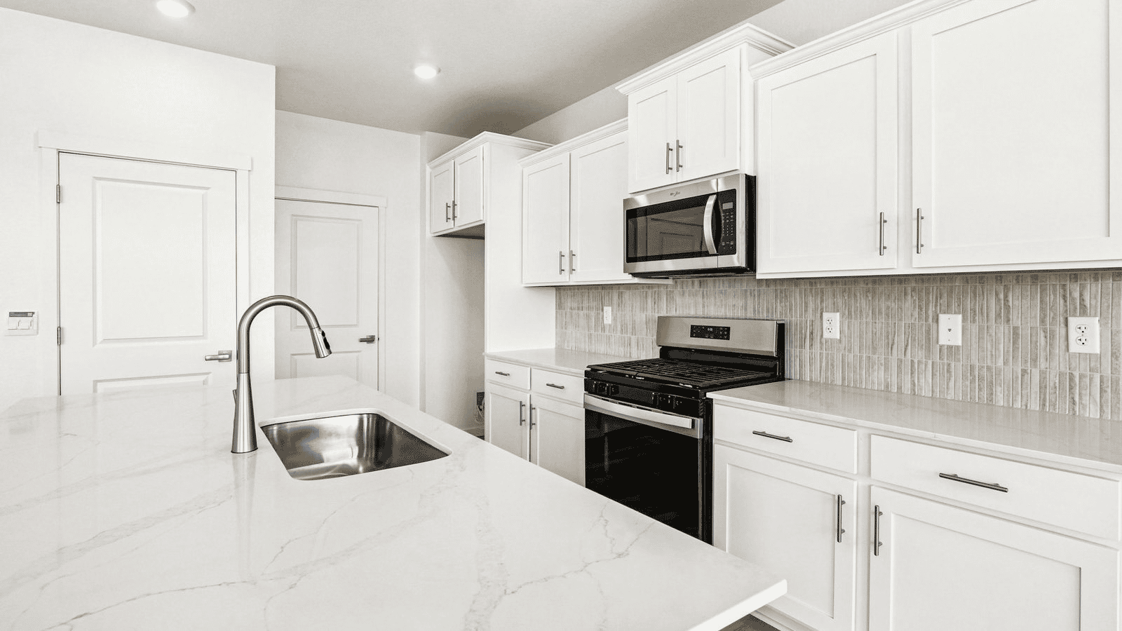 Kitchen with new finishes in new home at Granary community