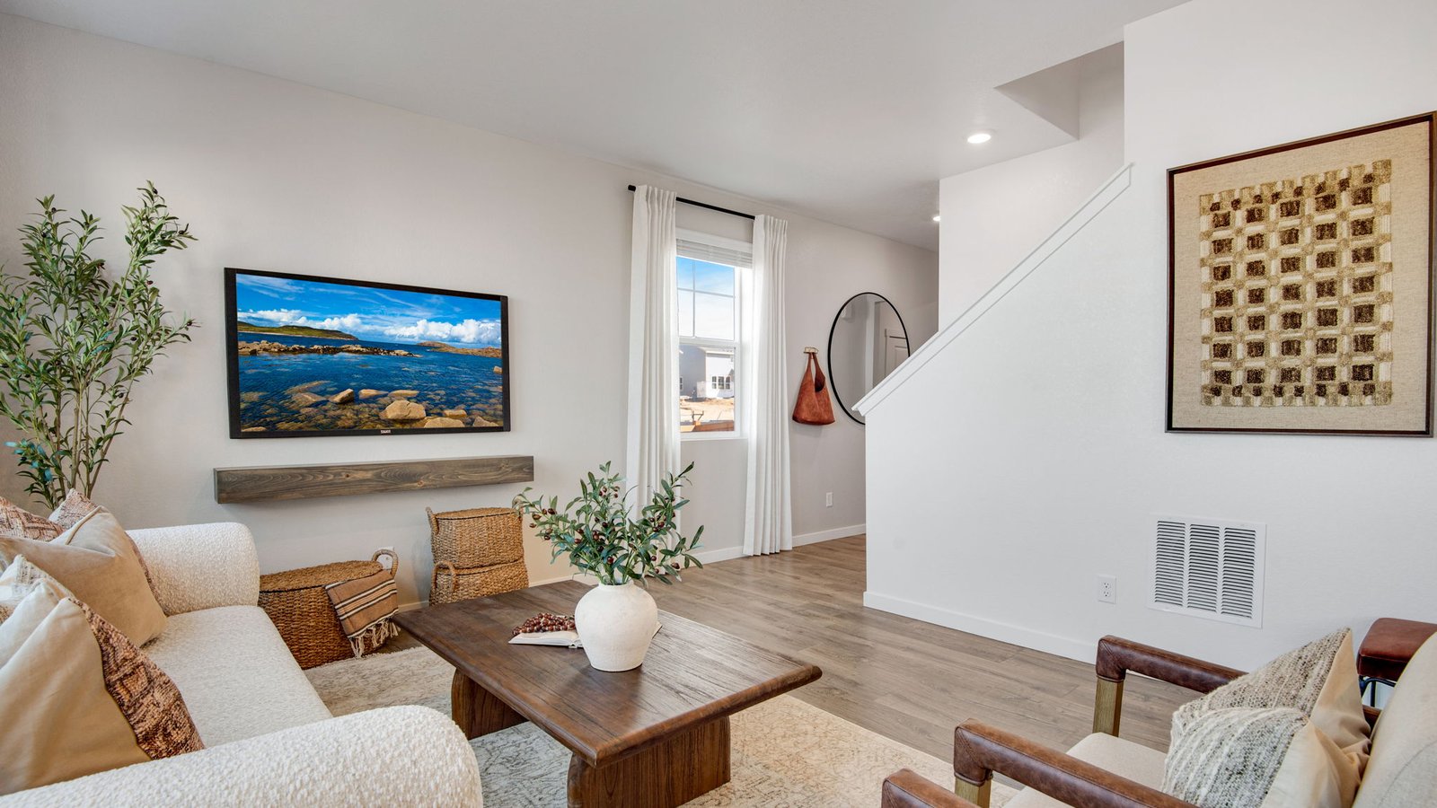Bright family room with ample space for gathering, relaxing, and entertaining.