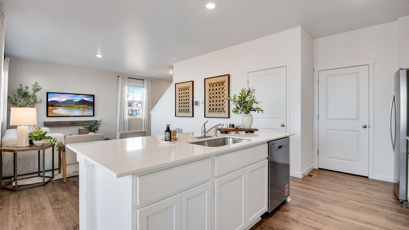 Spacious kitchen island providing additional seating and prep space.