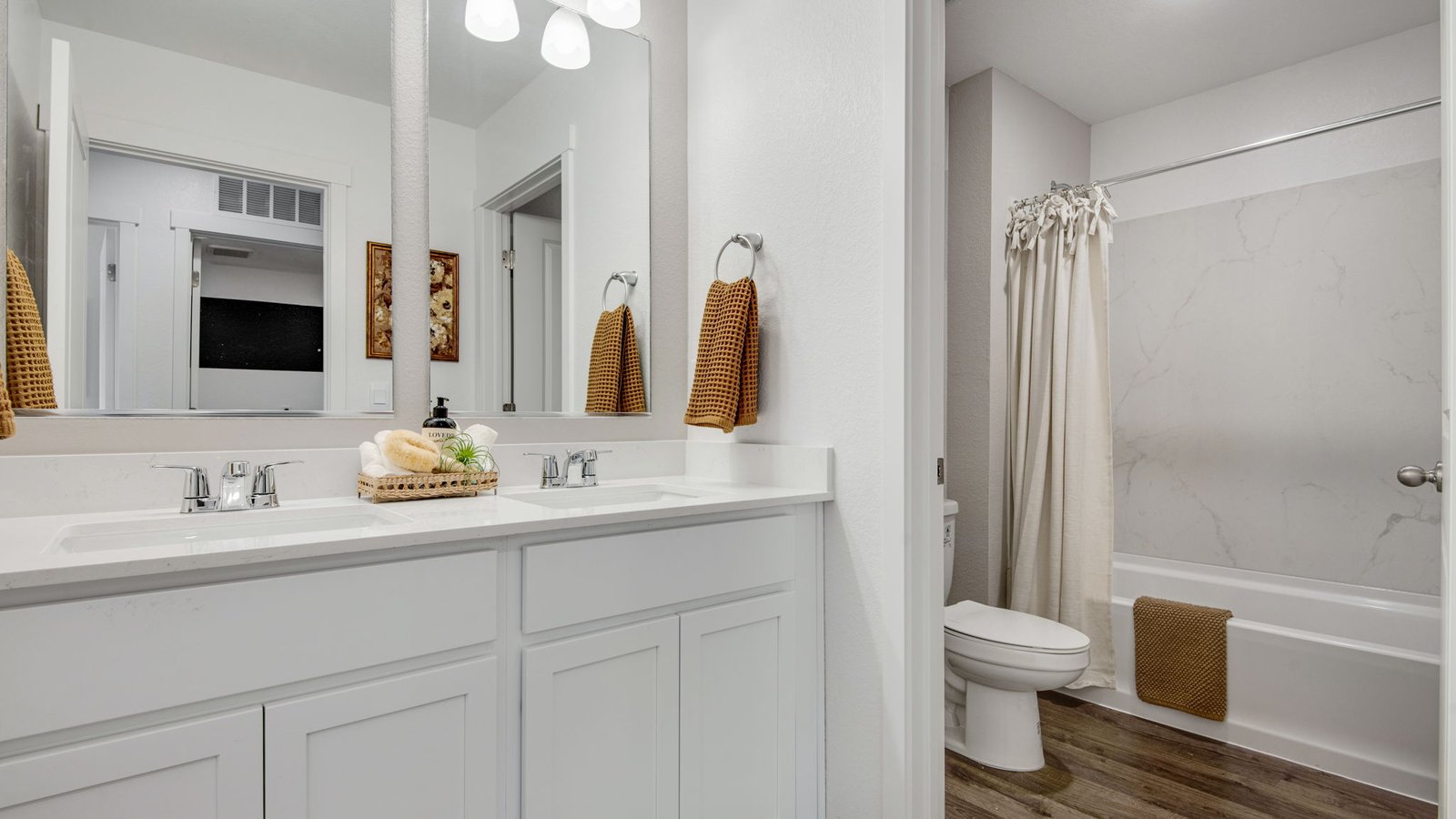 Full upstairs bathroom serving the secondary bedrooms in The Edmon.